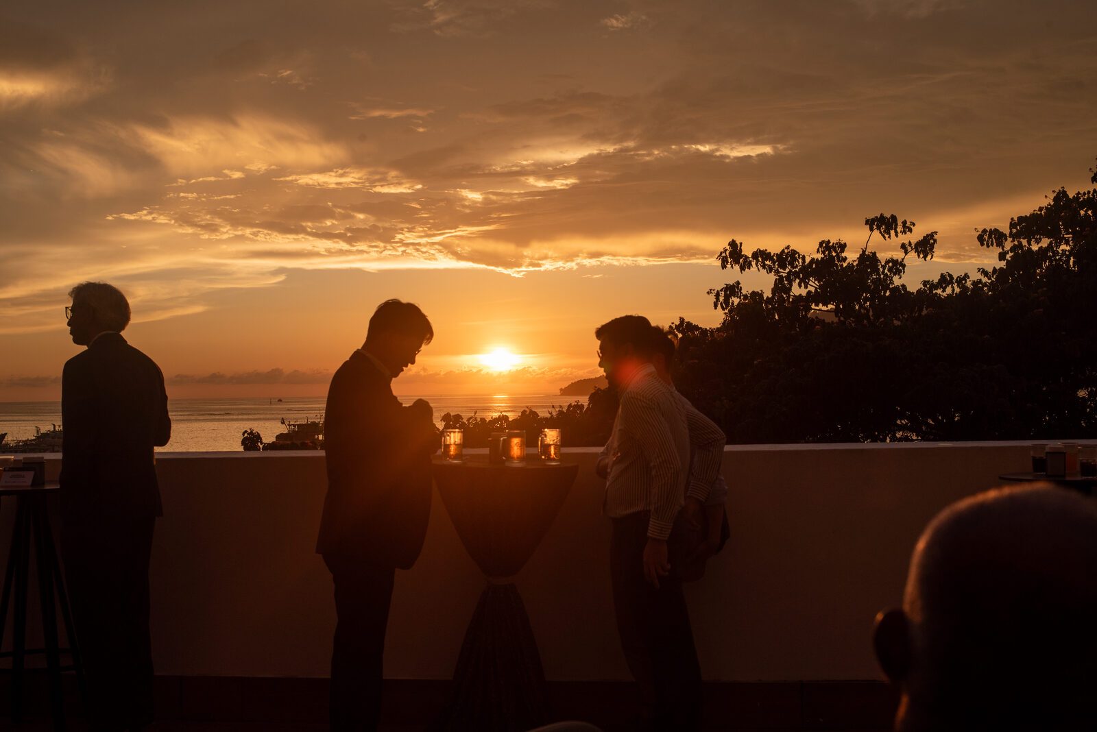 Day 1 closes with a rooftop reception at sunset over Kota Kinabalu